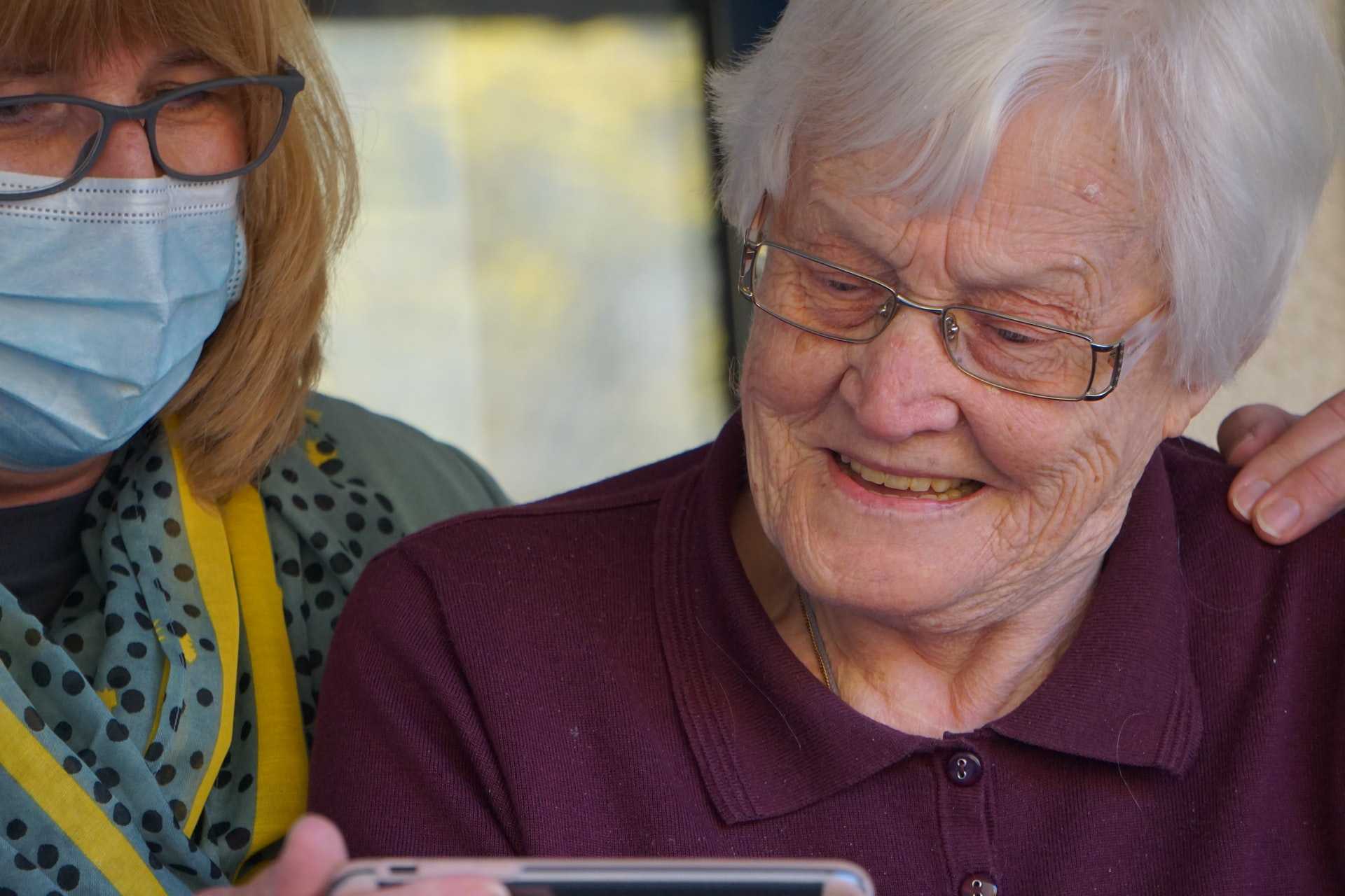 Nurse taking care of an elderly woman